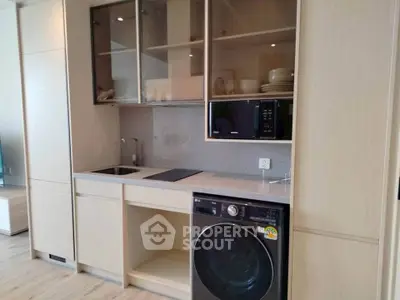 Modern kitchen with built-in appliances and sleek cabinetry