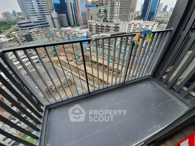 Modern balcony with city view in high-rise building, perfect for urban living enthusiasts.