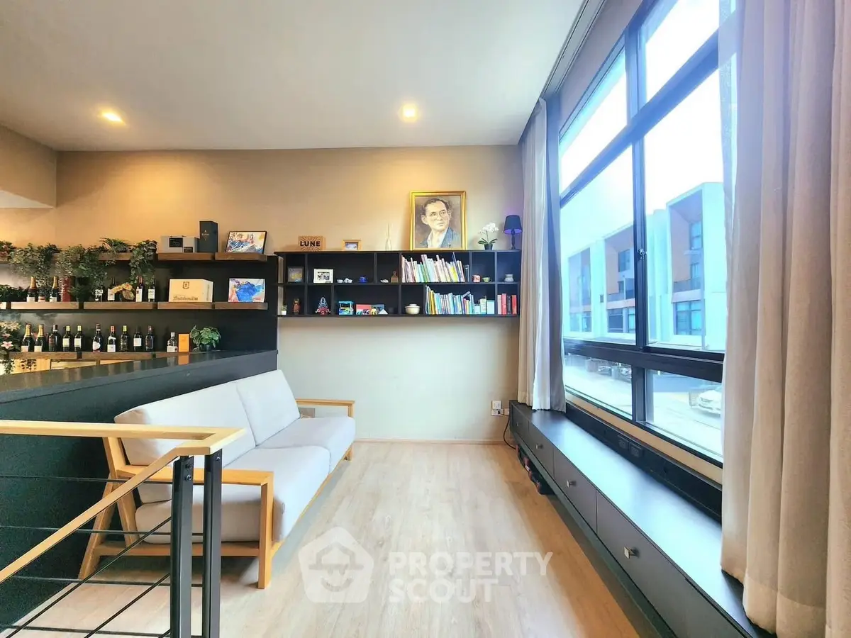 Modern living room with large windows and stylish shelving