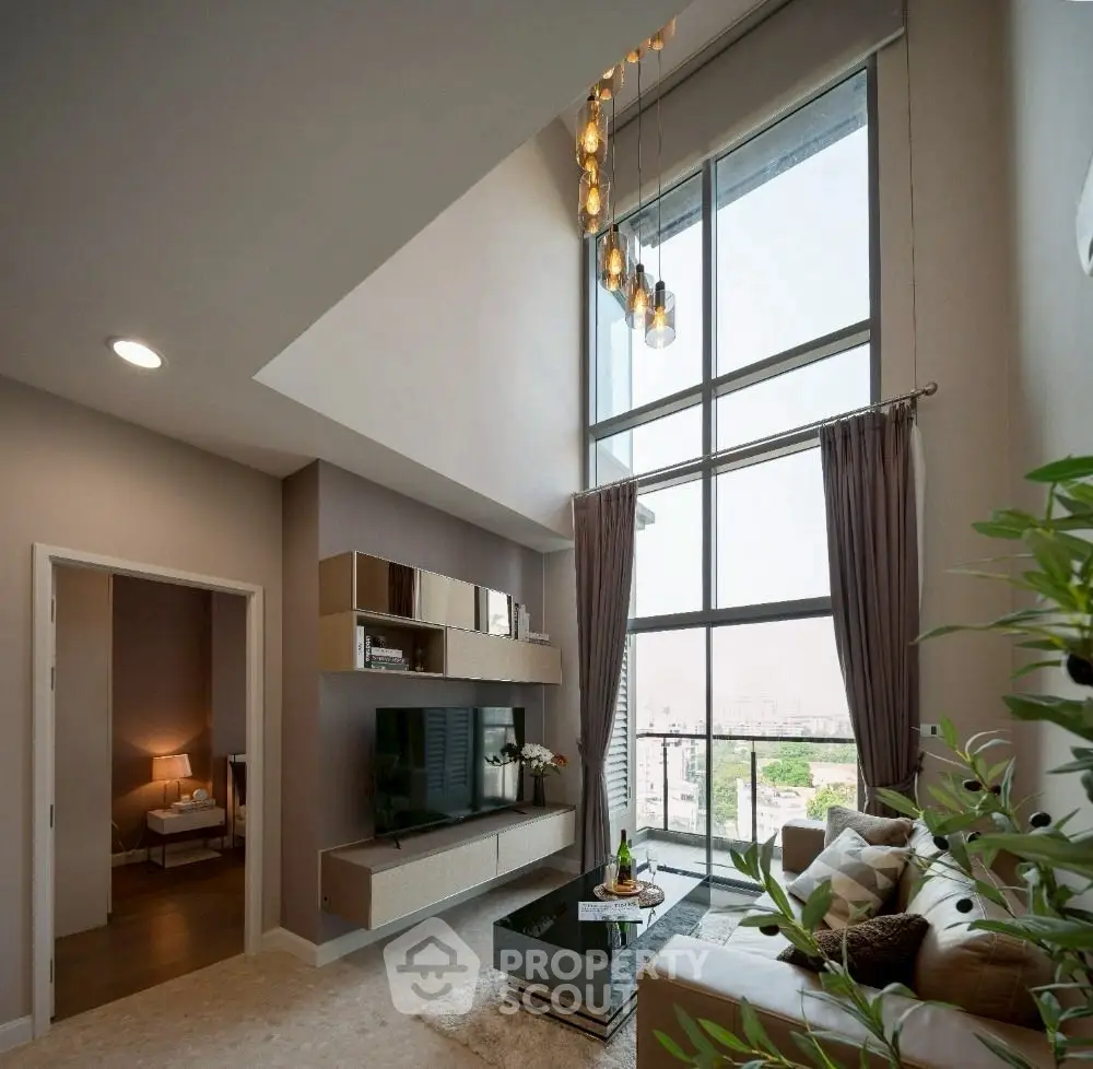 Luxurious high-ceiling living room with stunning city view and modern decor