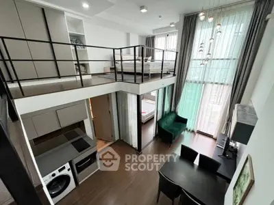 Modern loft apartment with high ceilings, mezzanine bedroom, and stylish open-plan living area.