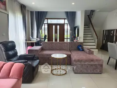 Spacious living room with modern furniture and natural light