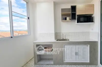 Modern kitchen with open shelving and scenic window view