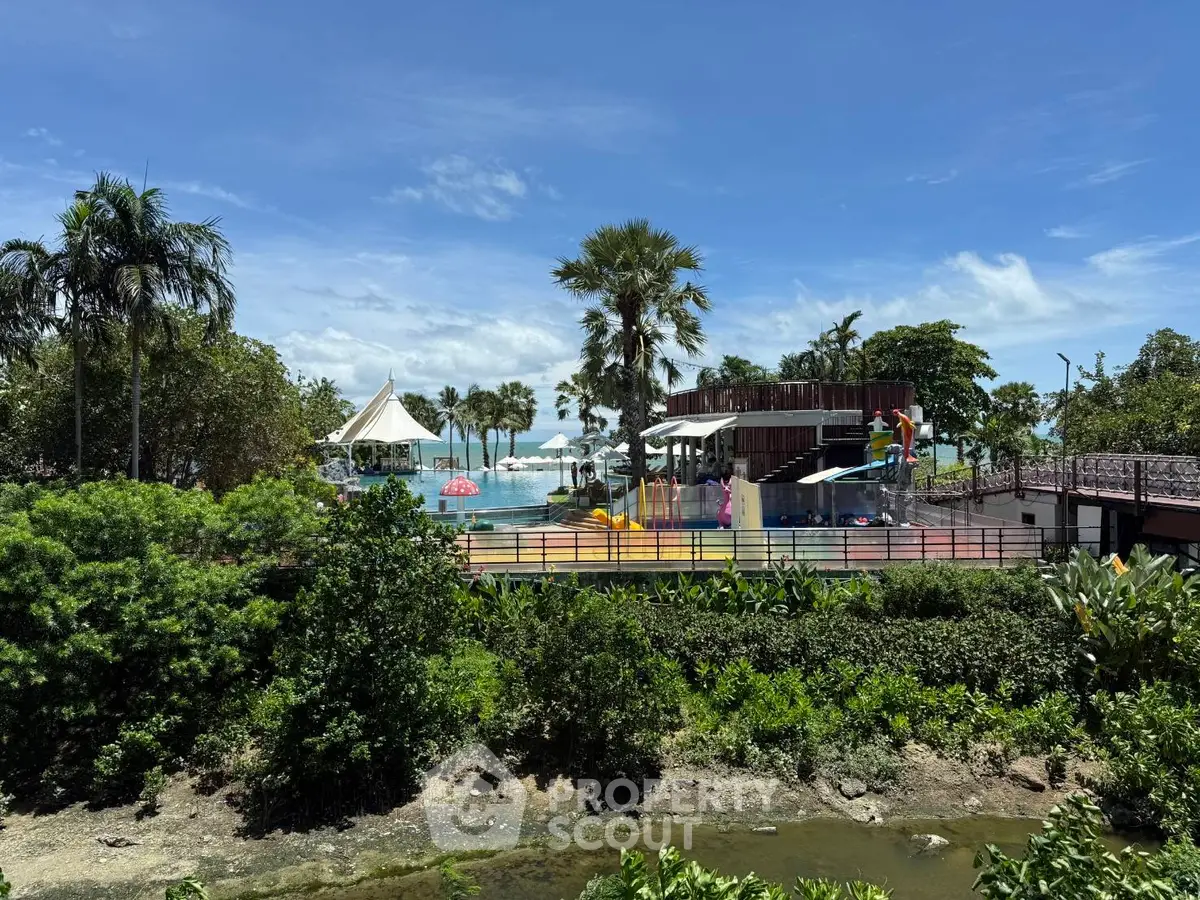 Stunning beachfront property with lush greenery and recreational amenities.