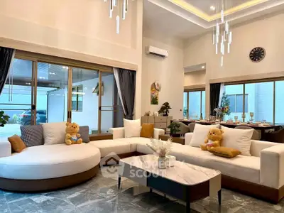 Luxurious modern living room with elegant decor and plush seating in a spacious open layout.