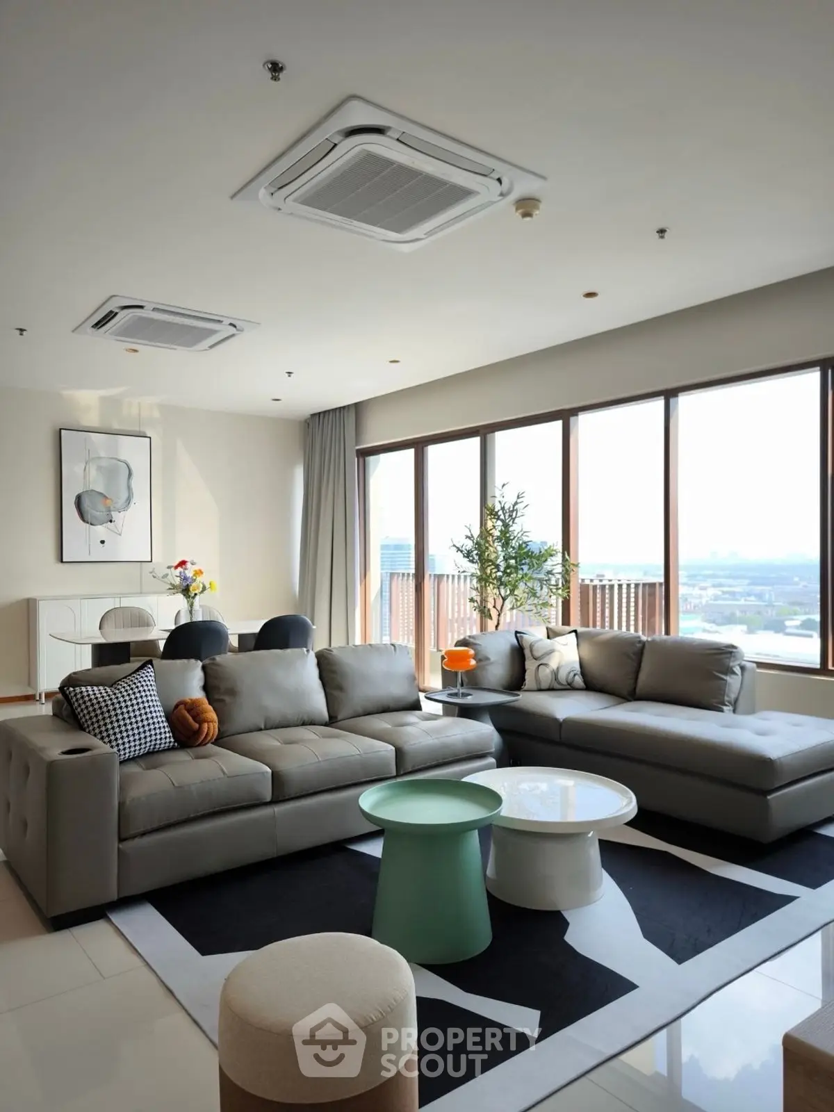 Spacious modern living room with large windows and stylish furniture