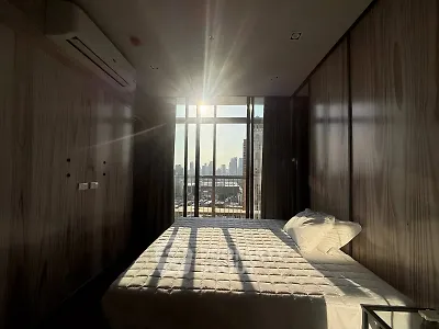 Modern bedroom with stunning city view and natural light