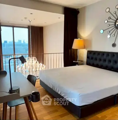 Luxurious bedroom with city view and modern decor, featuring a stylish chandelier and elegant furnishings.