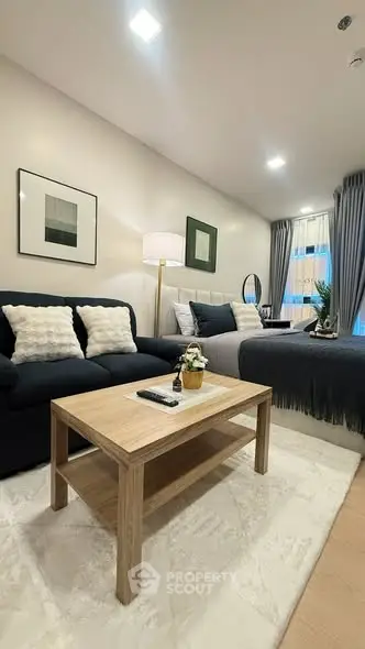 Modern studio apartment with cozy living area and stylish decor