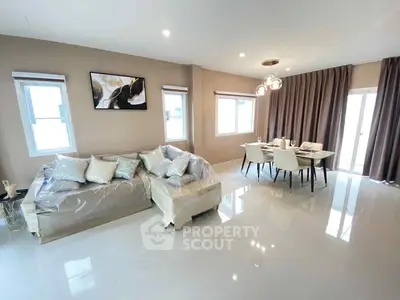 Spacious modern living room with elegant dining area and natural light