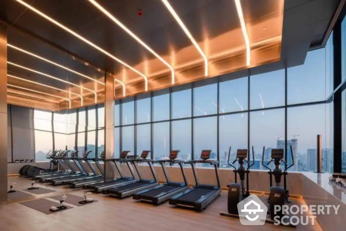 Luxurious high-rise gym with panoramic city views and modern fitness equipment.