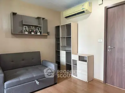 Modern living room with stylish furniture and air conditioning in a cozy apartment.