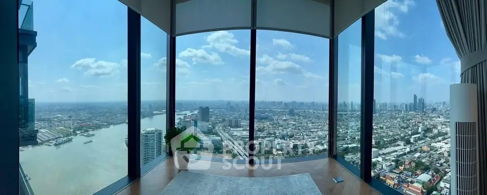 Stunning panoramic city view from a high-rise corner unit with floor-to-ceiling windows.