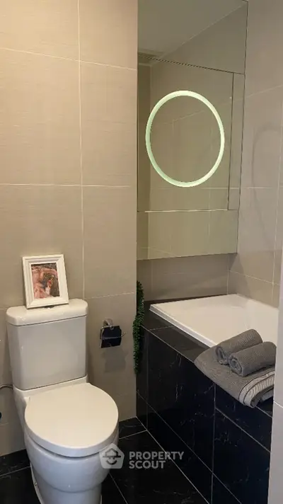 Modern bathroom with elegant fixtures and stylish bathtub