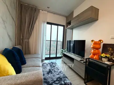 Modern living room with stylish decor and balcony view