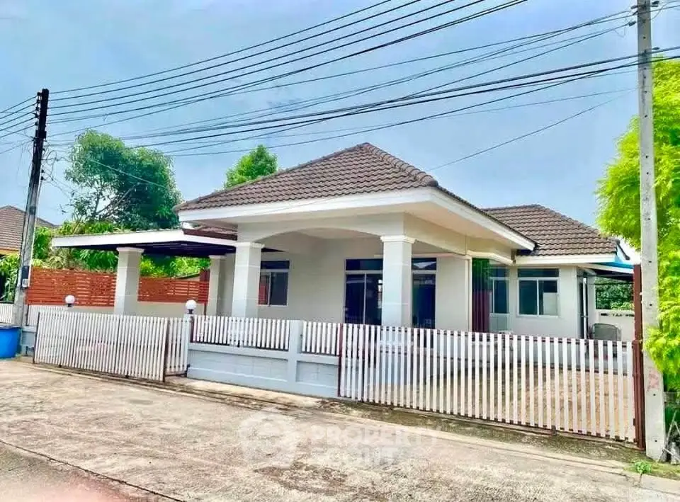 Charming single-story home with a spacious front yard and modern design in a serene neighborhood.