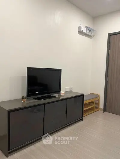 Modern living room with sleek TV stand and minimalist decor