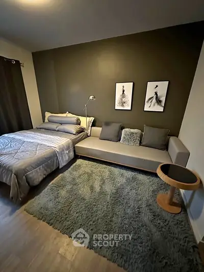 Stylish bedroom with modern decor and cozy seating area