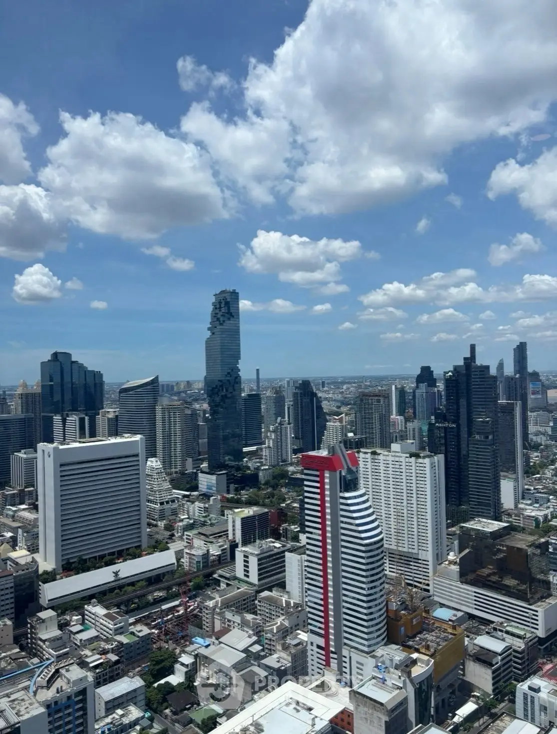 Stunning cityscape view showcasing modern skyscrapers under a vibrant blue sky.