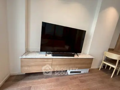Modern living room with sleek TV stand and mounted flat-screen TV