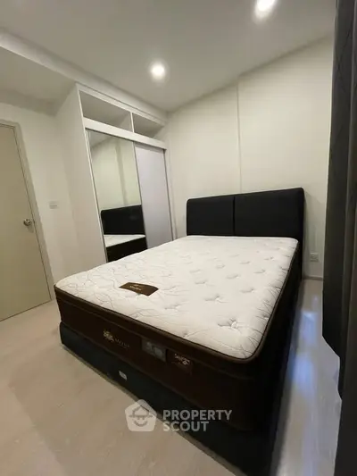 Modern bedroom with comfortable mattress and sleek wardrobe