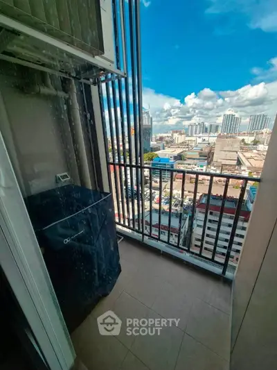 Stunning city view from a high-rise balcony, perfect for urban living.
