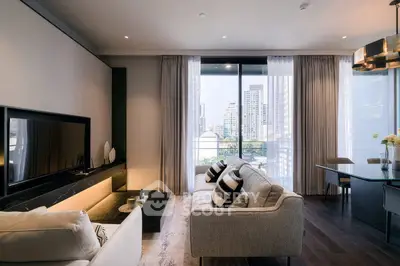 Luxurious modern living room with large windows and city view, featuring elegant furniture and stylish decor.