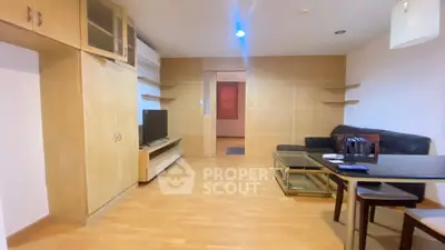 Spacious living room with modern furniture and wooden flooring