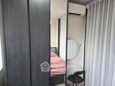 Modern bedroom with sleek wardrobe and stylish decor