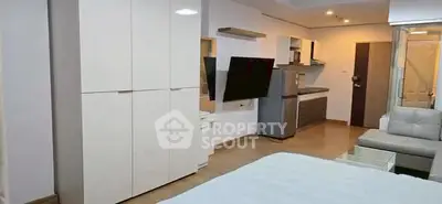 Modern studio apartment with sleek furniture and open layout in prime location.