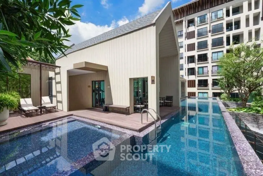 Luxurious modern apartment with stunning pool and lush greenery