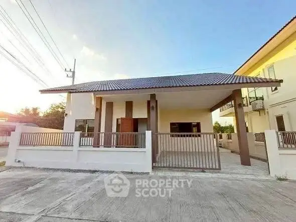Charming single-story house with modern design and spacious driveway in a serene neighborhood.
