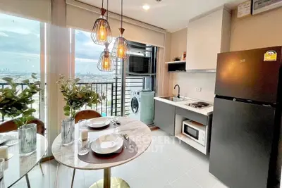 Modern kitchen with city view, featuring sleek appliances and stylish lighting, perfect for urban living.