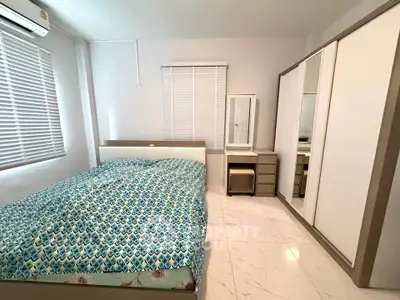 Spacious bedroom with modern furniture and stylish decor