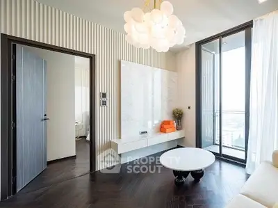 Modern living room with elegant lighting and large windows offering stunning views.