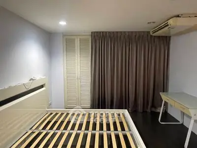 Spacious bedroom with modern design and ample natural light