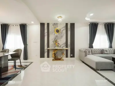 Luxurious modern living room with elegant marble accents and plush seating