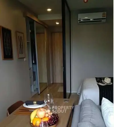 Cozy modern living space with dining area and air conditioning