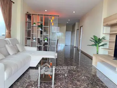 Spacious modern living room with marble flooring and elegant decor