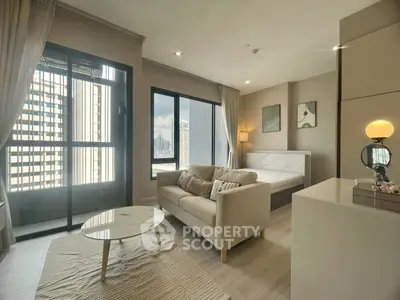 Modern studio apartment with city view, featuring cozy living area and elegant decor.