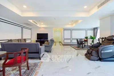 Spacious modern living room with elegant decor and marble flooring