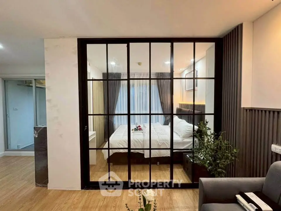 Modern bedroom with glass partition and elegant decor
