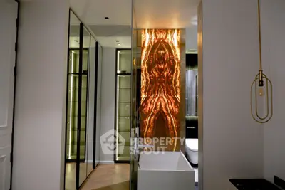 Luxurious bathroom with modern design and unique backlit feature wall.