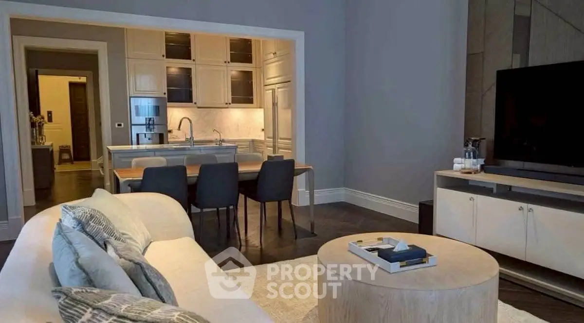 Modern living room with open kitchen layout and stylish decor