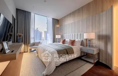 Luxurious modern bedroom with city view, elegant decor, and cozy ambiance.
