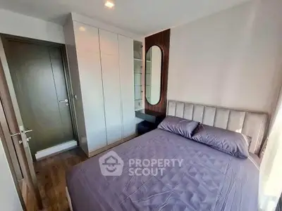 Modern bedroom with sleek wardrobe and stylish mirror design