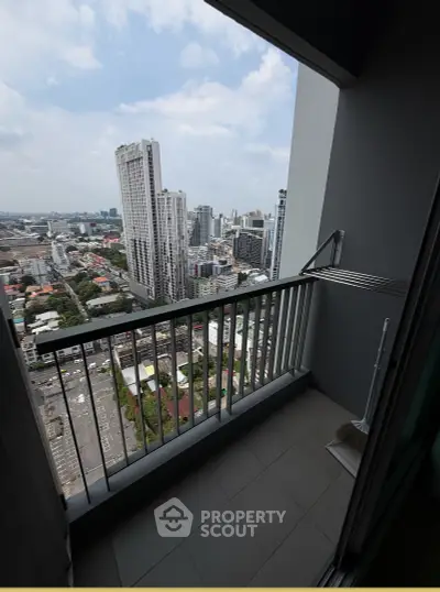 Stunning high-rise balcony with panoramic city views, perfect for urban living enthusiasts.