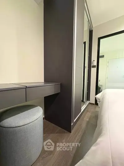 Modern bedroom with sleek wardrobe and stylish furniture