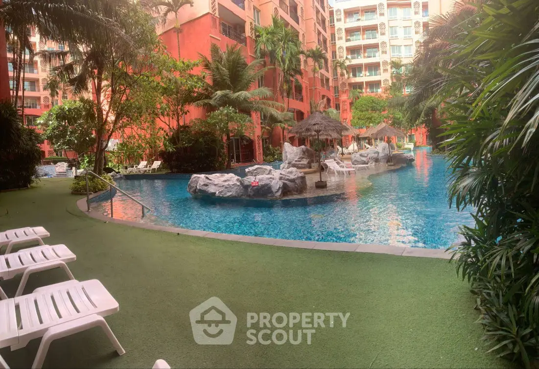 Luxurious tropical pool area with lush greenery and resort-style amenities.