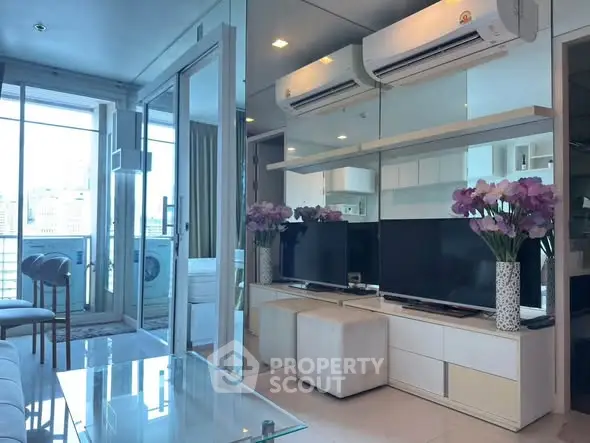 Modern living room with mirrored wall, air conditioning, and balcony view